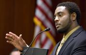 FILE - In this Nov. 5, 2009 file photo, Reginald Dwayne Betts, writing workshop program director, speaks during a school forum on Capitol Hill in Washington. Betts, a convicted felon who graduated from Yale Law School and won acclaim as a poet is being asked by a Connecticut committee to prove his "good moral character" before he is allowed to practice law. Like most states, Connecticut does not prohibit felons from becoming attorneys, but a felony conviction creates a presumption that the applicant lacks "good moral character and/or fitness to practice law." Such applicants must prove otherwise by "clear and convincing evidence."(AP Photo/Alex Brandon, File)